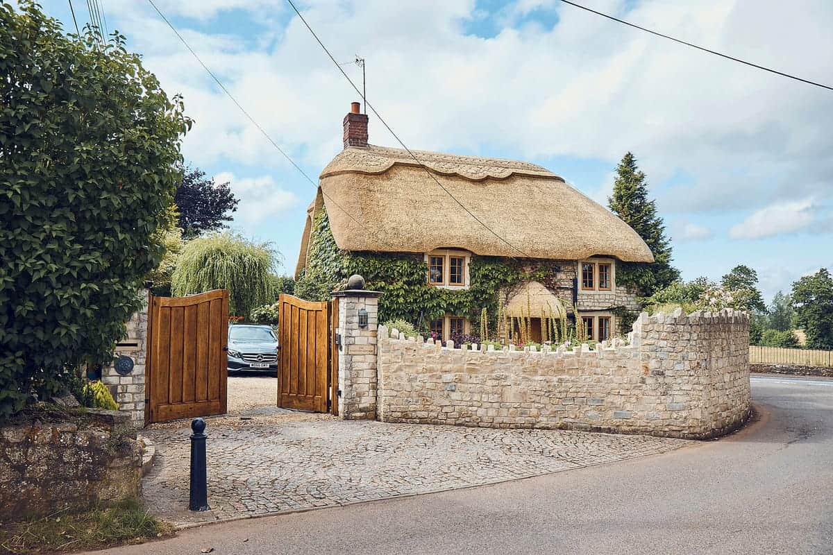 Master thatcher at work on a Frome thatched roof