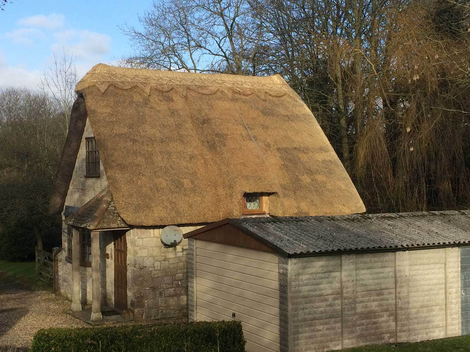 The dense, packed structure of high-quality thatch, expertly applied.