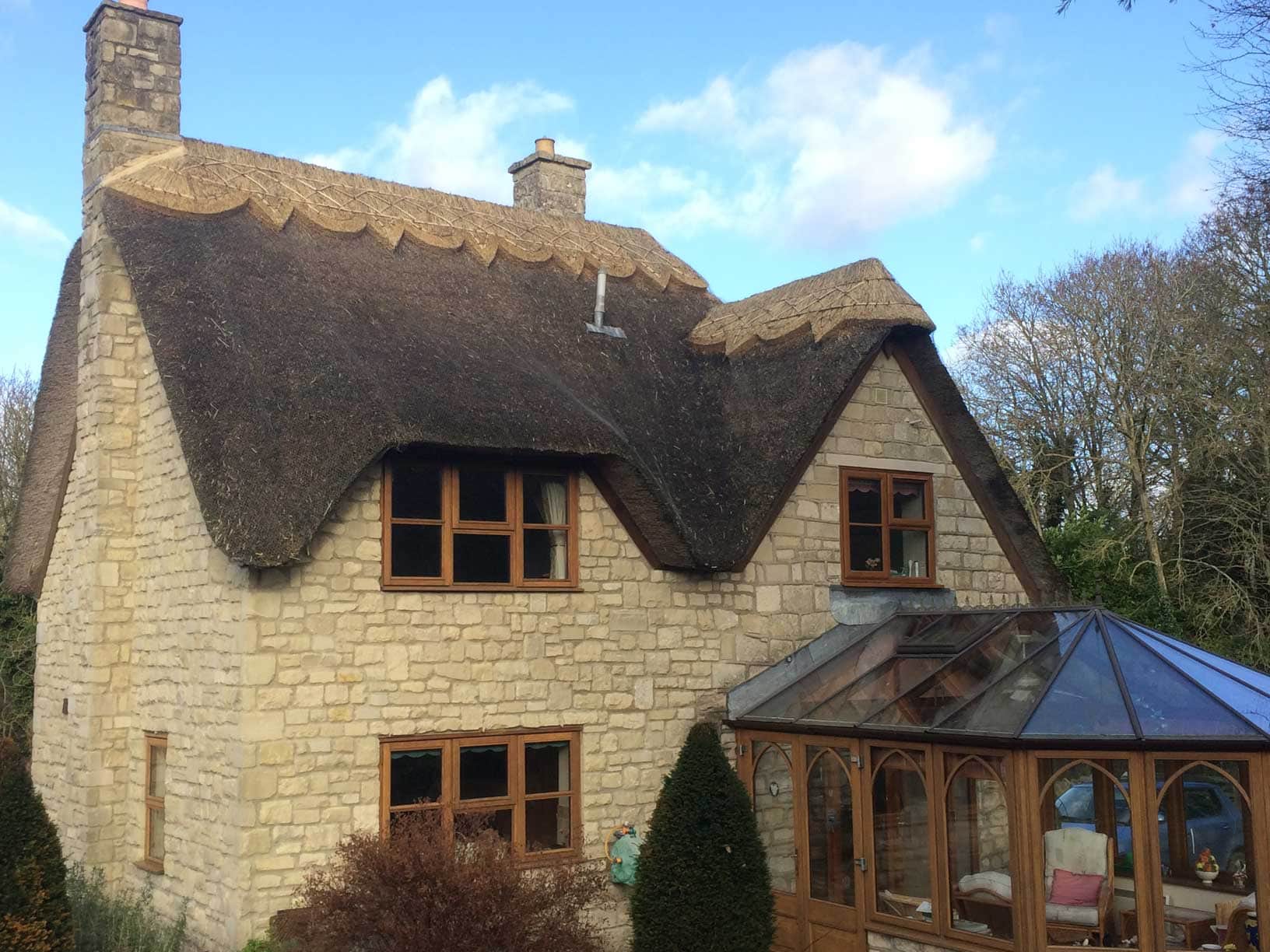 Expert flashing and thatching around chimneys to prevent water ingress.